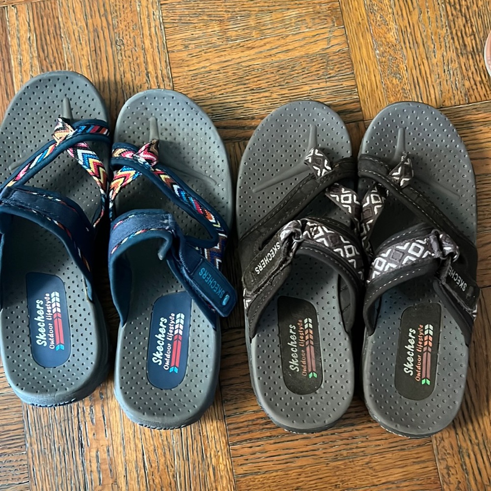 Two pairs of sketchers flip flops